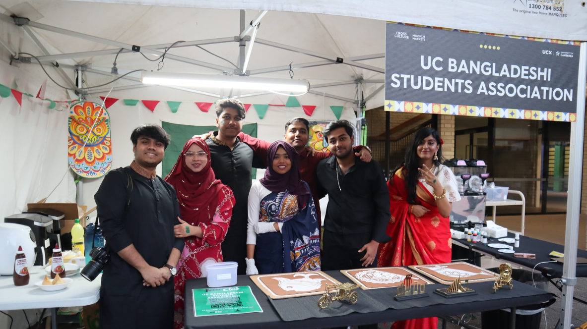 7 UC Bangladeshi Students as part of the Student Association stand